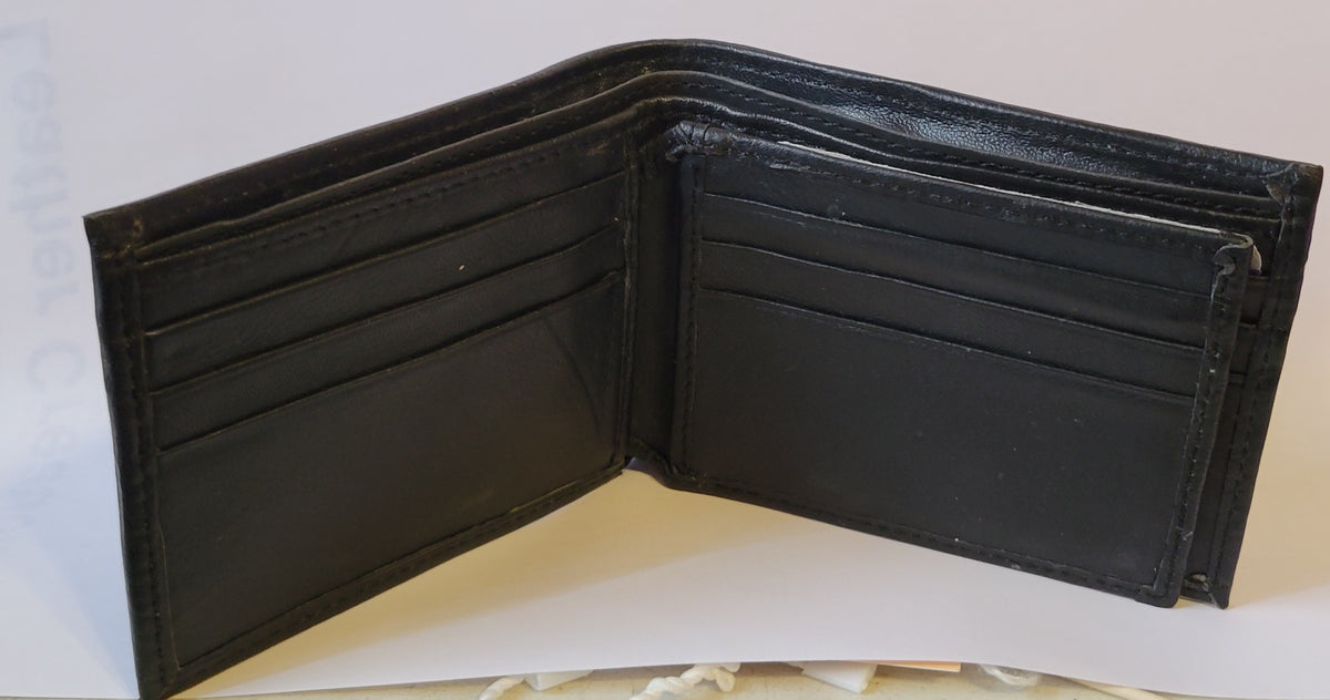 An open black leather bi-fold wallet with multiple card slots and bill compartments, photographed against a plain light background.